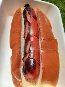 A grilled hot dog is shown