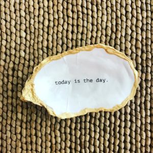 today is the day is printed on an oyster shell